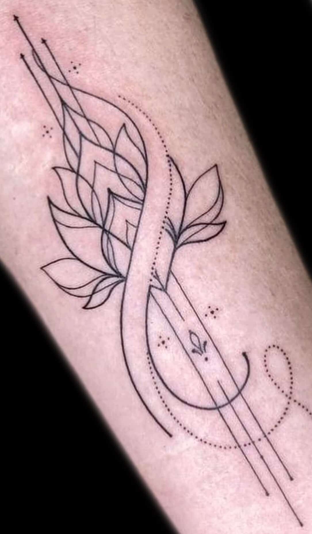 Fine line botanical tattoo on arm — minimal design for tourists at INKspire El Gouna